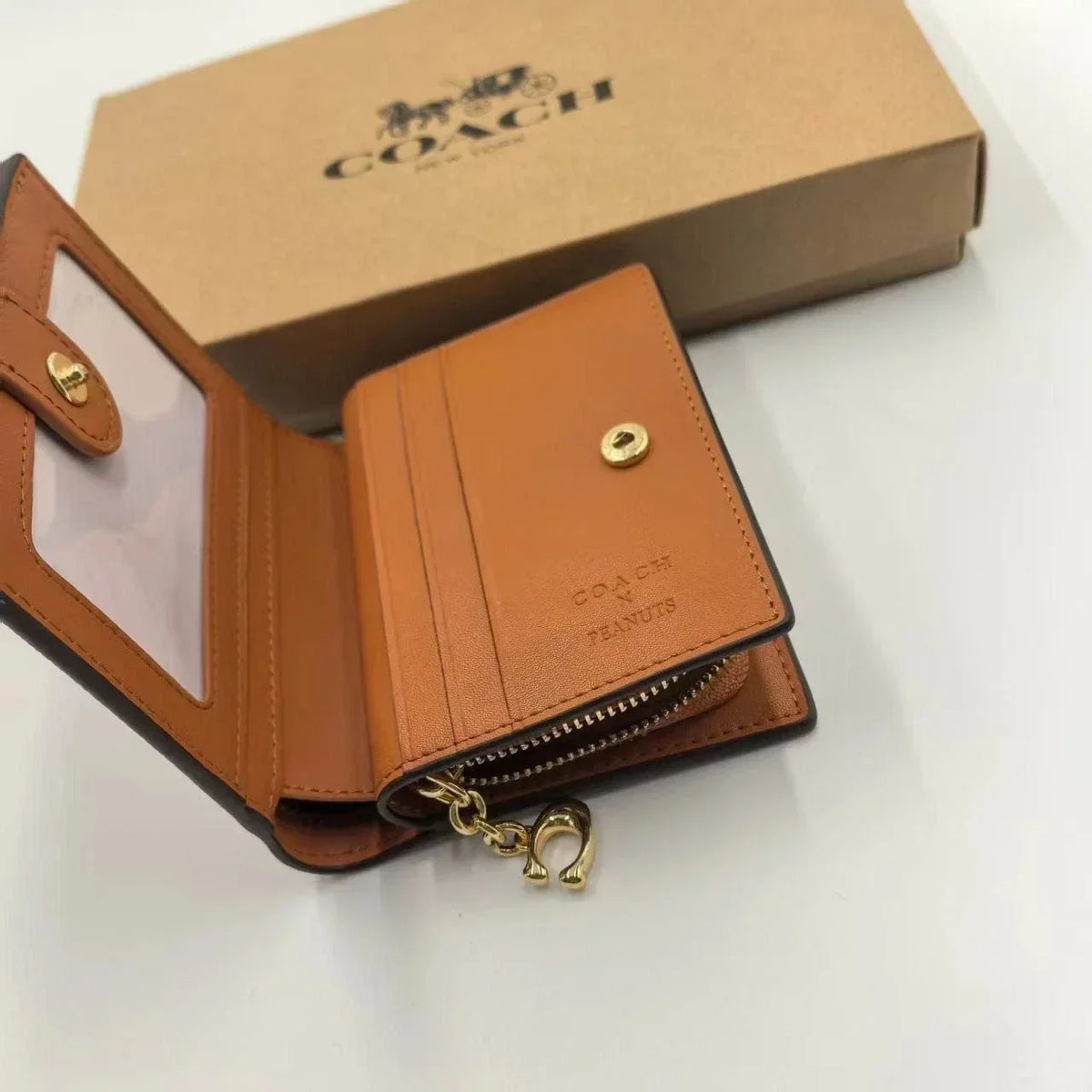 Coach X Peanuts Snap Wallet In Signature Canvas With Snoopy Print CBN32
